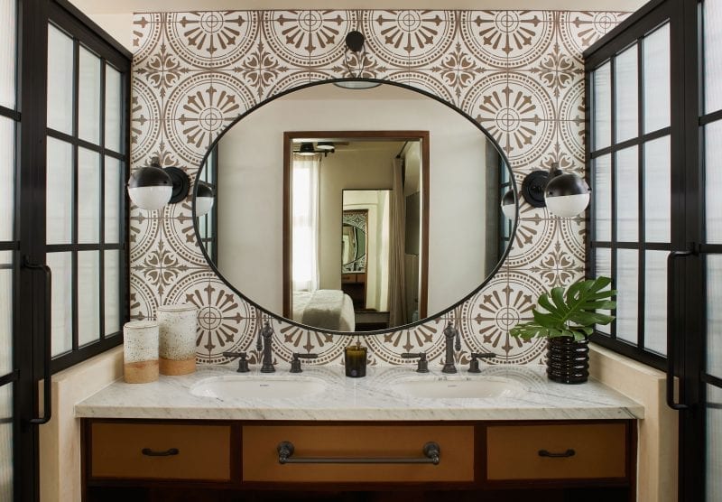 a bathroom with a sink and mirror