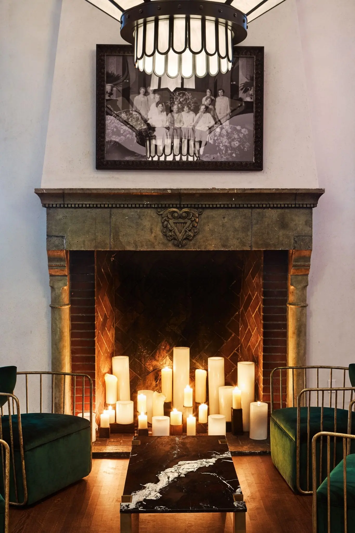 large fireplace with chairs and coffee table