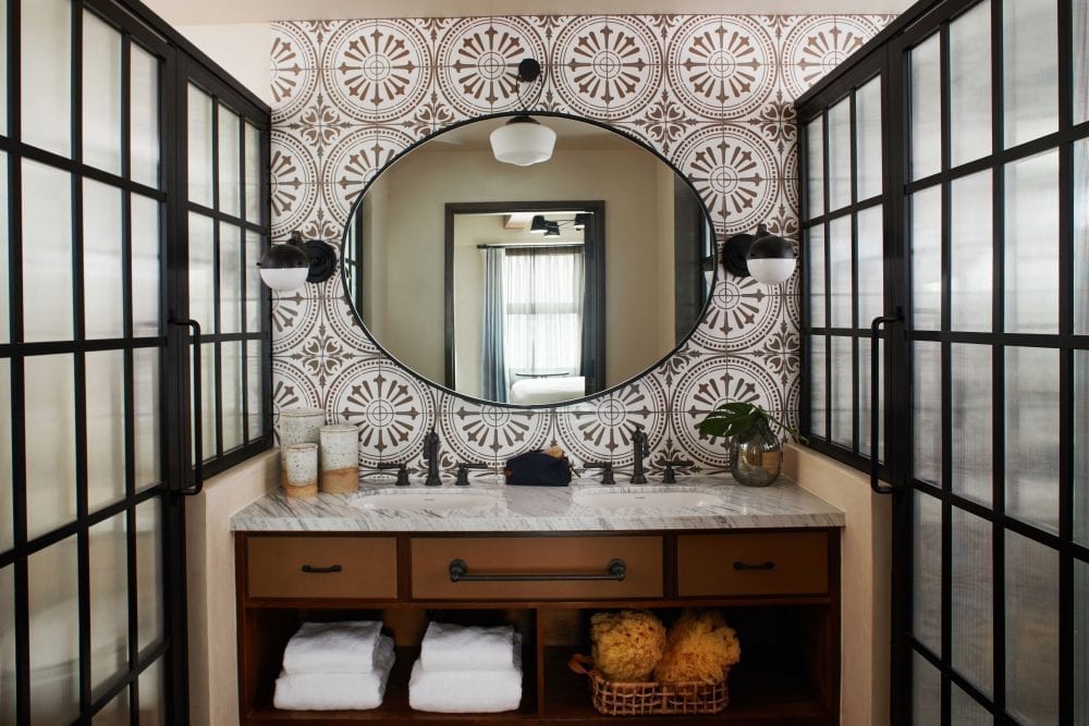 a bathroom with a sink and mirror