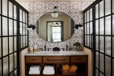 a bathroom with a sink and mirror