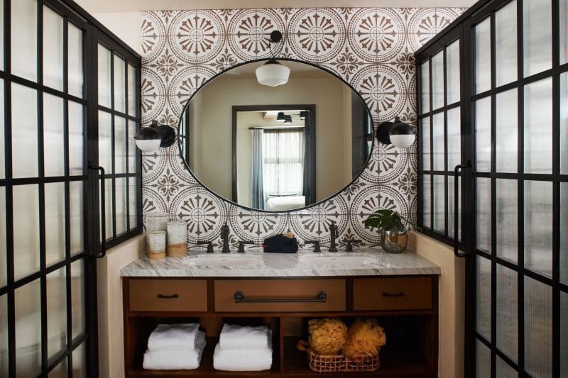 a bathroom with a sink and mirror