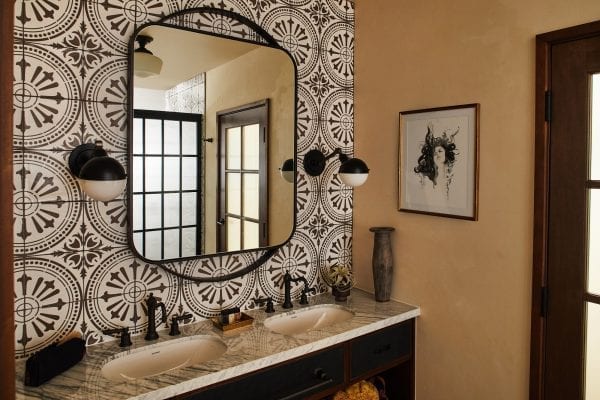 a bathroom with a sink and mirror