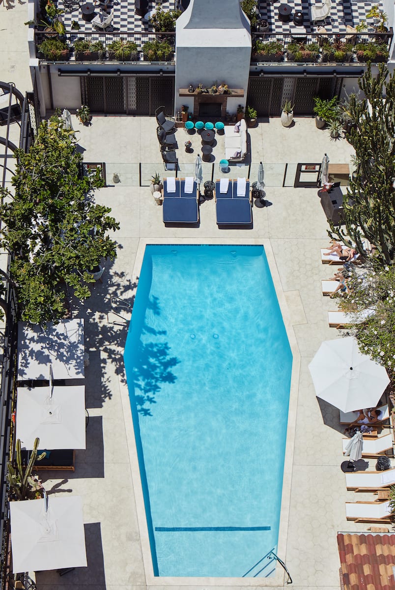 overhead view of hotel pool and surrounding lounge area