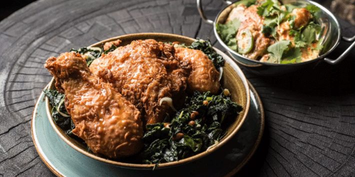 dish with fried chicken and collard greens