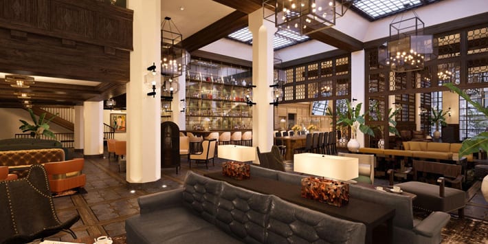 lounge area with leather sofas, chairs, and bar